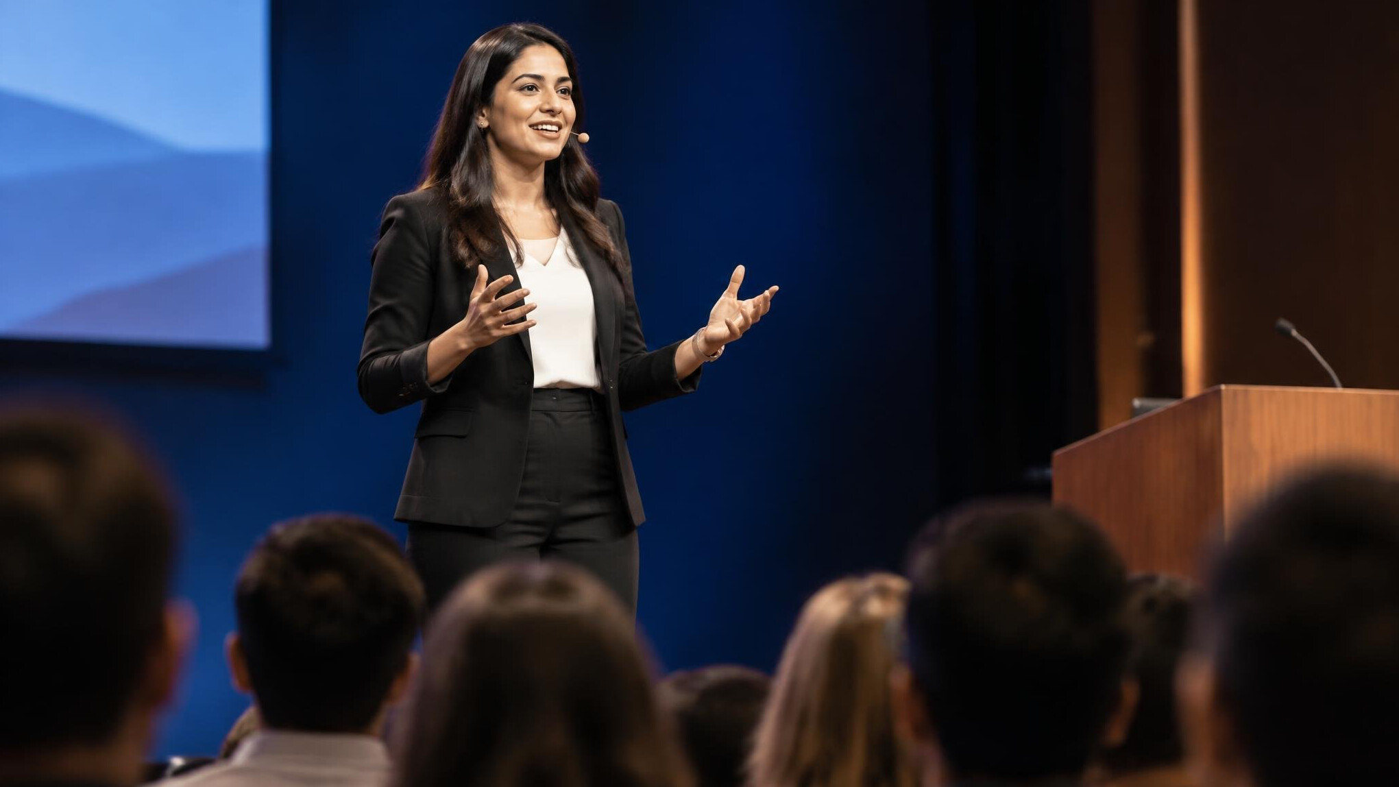 confident speaker on stage